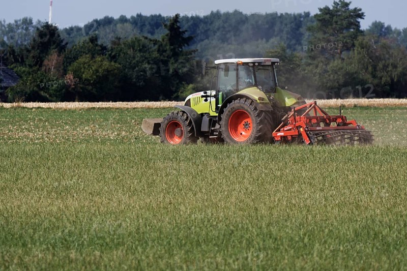 Farmer is cultivating field