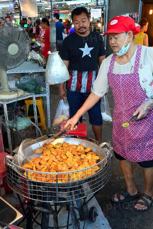 Fish cakes being deep fried