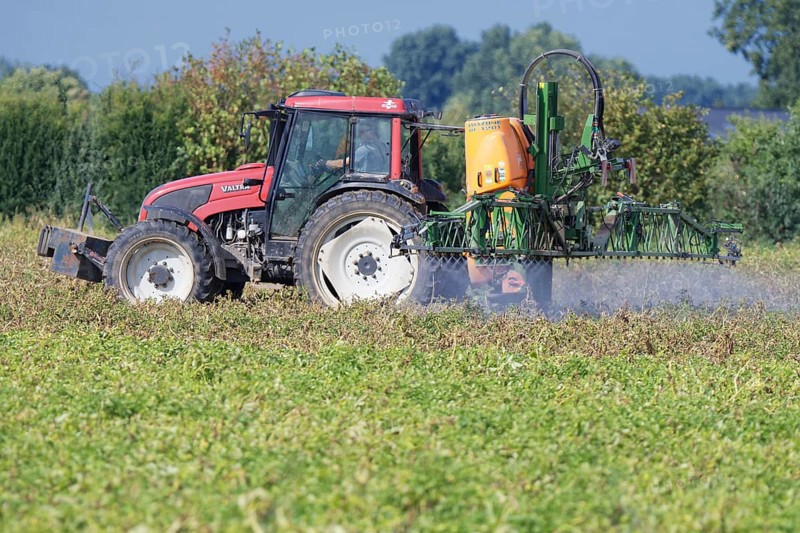 Farmer spraying pesticides