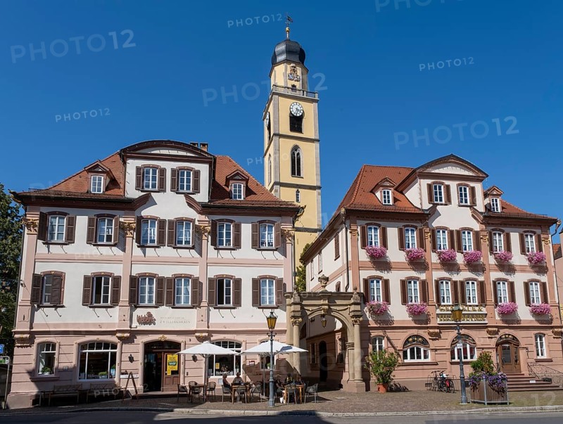 Twin houses and church tower of St. John's Minster on the market square in Bad Mergentheim