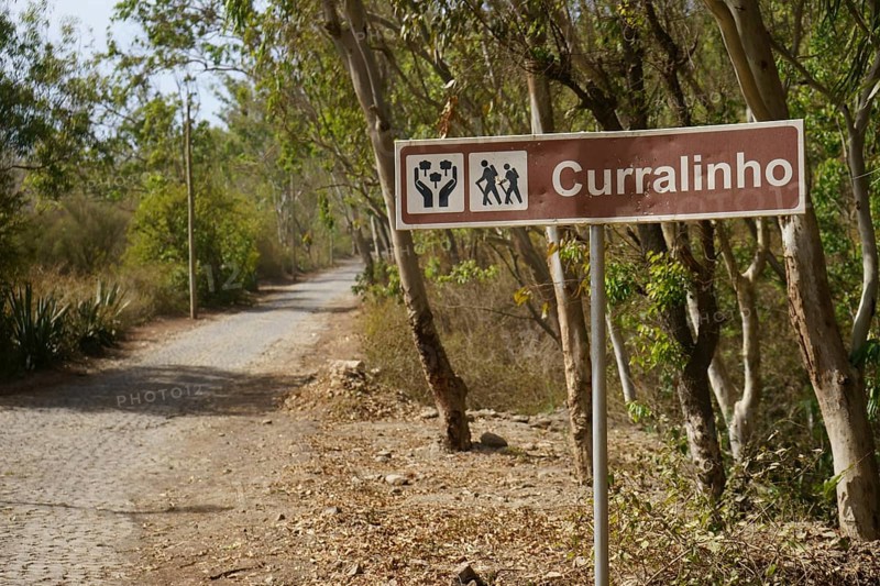 Paved road and town sign Curralinho