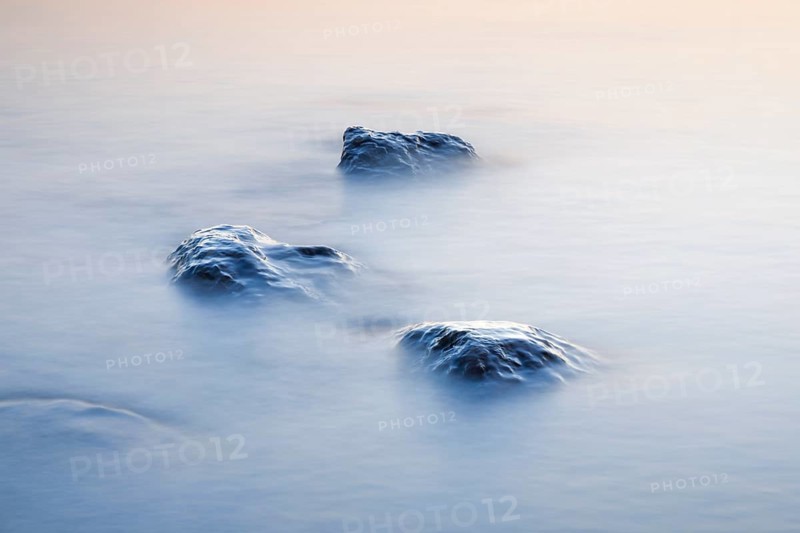 Stones in water photographed with slow shutter speed