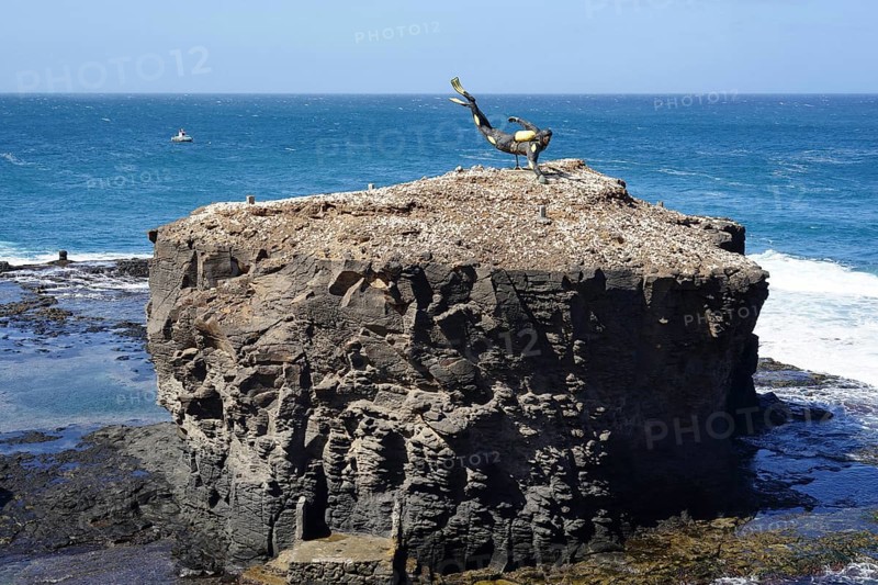 Diver statue on rocks