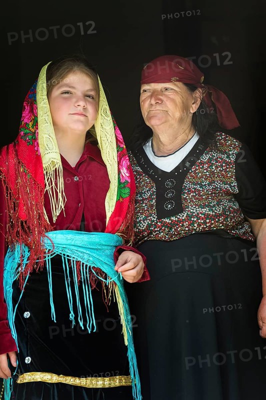 Grandmother and granddaughter in traditional dress