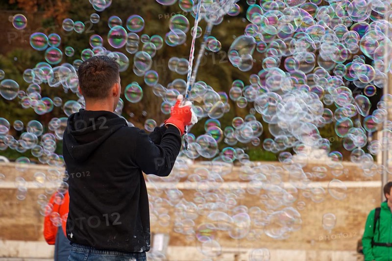 Man blowing soap bubbles