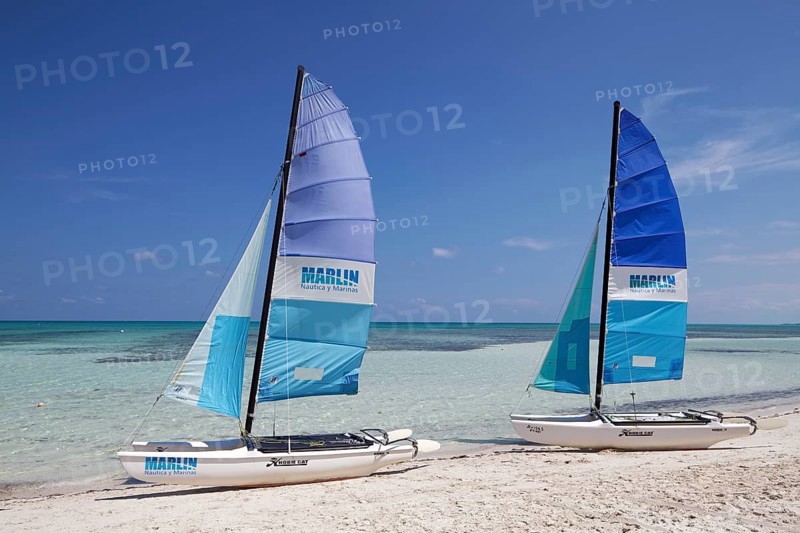Sandy beach beach with two catamarans