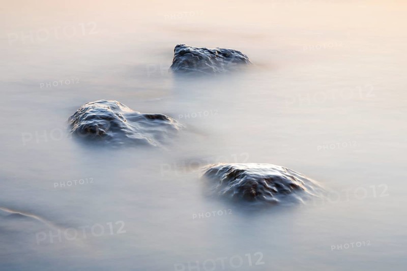 Stones in water photographed with slow shutter speed