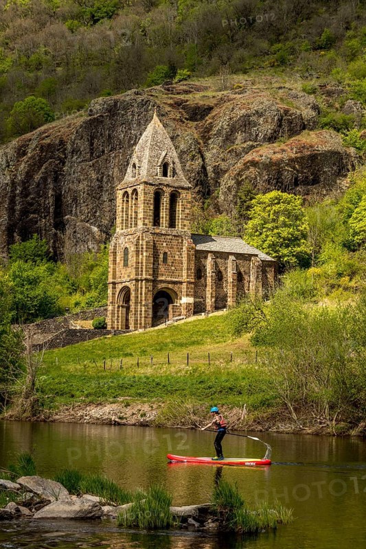 Notre Dame des Chazes church on the River Allier with canoeists