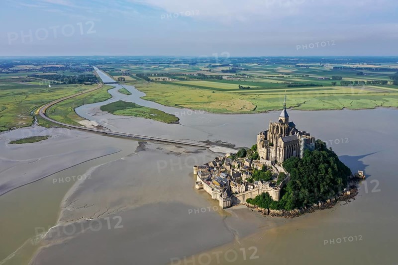 Drone shot from the Atlantic Ocean to the historic monastery of Le Mont Saint Michel