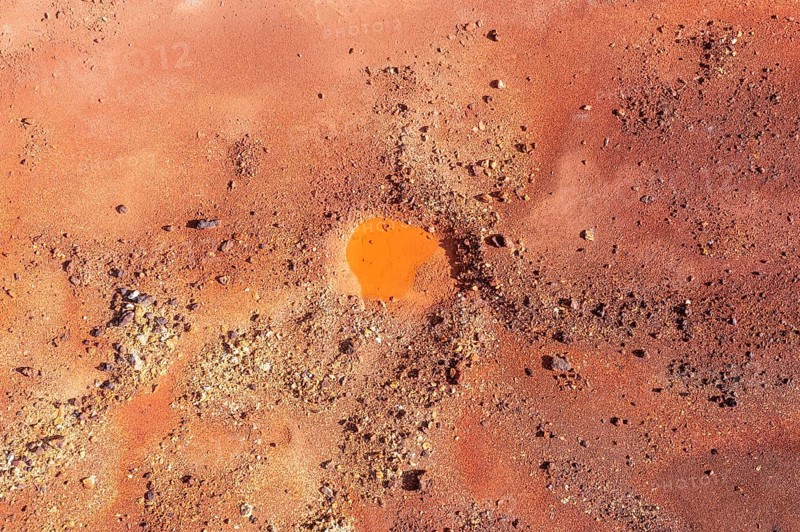 Little pool and extremely mineral-rich ground in the area of the Rio Tinto mines