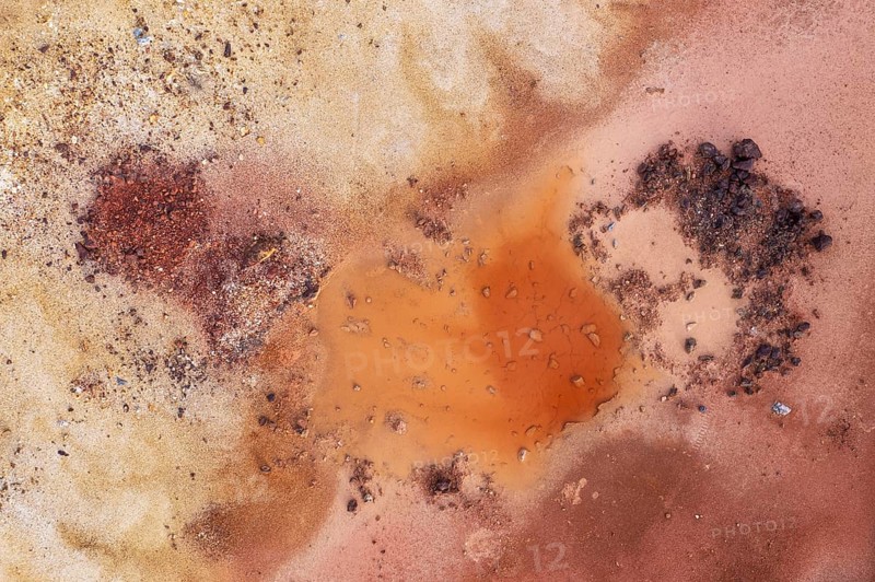 Little pool and extremely mineral-rich ground in the area of the Rio Tinto mines