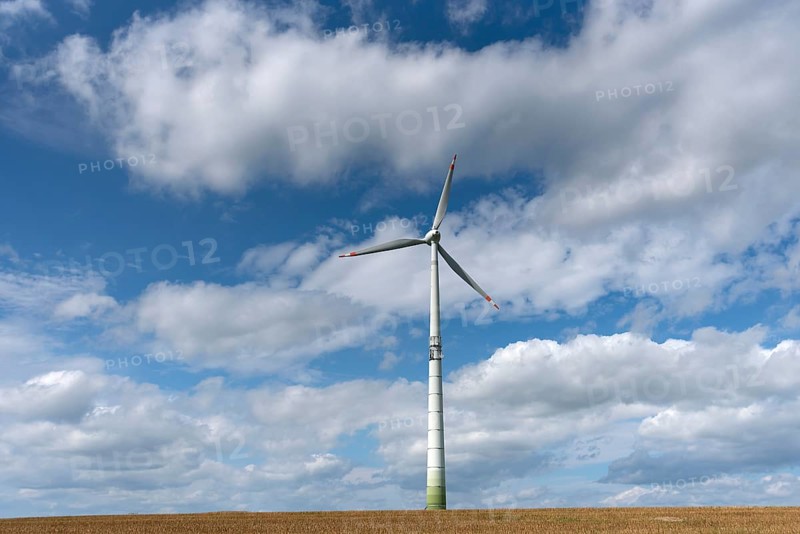 Windmill and cloudy sky