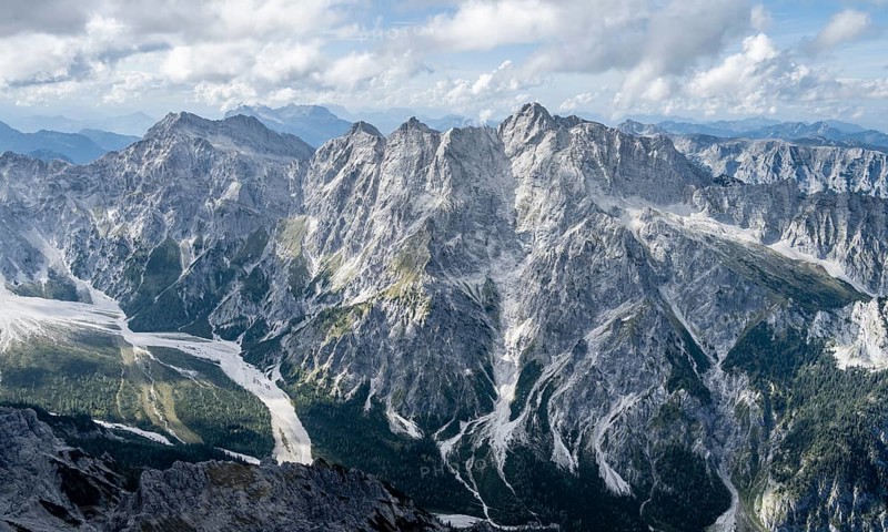 Hiker with helmet looking at mountains