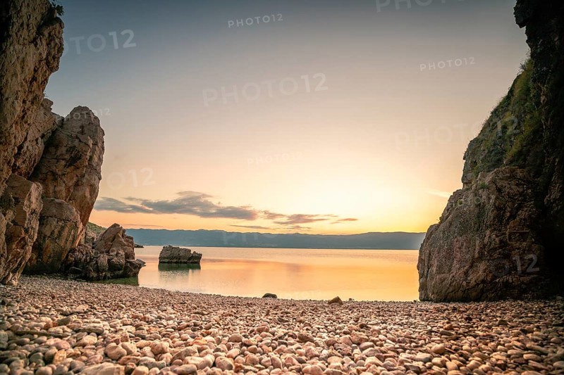 A small stone beach by the sea