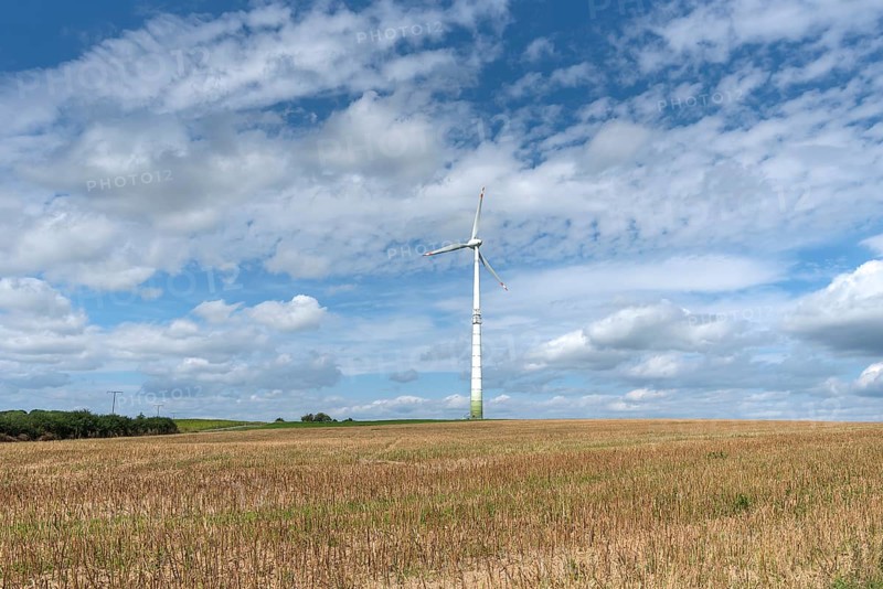 Windmill and cloudy sky
