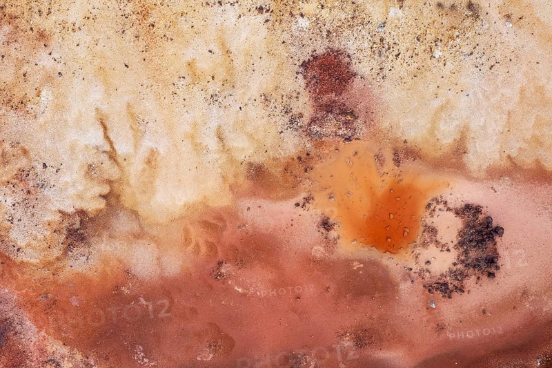 Little pool and extremely mineral-rich ground in the area of the Rio Tinto mines