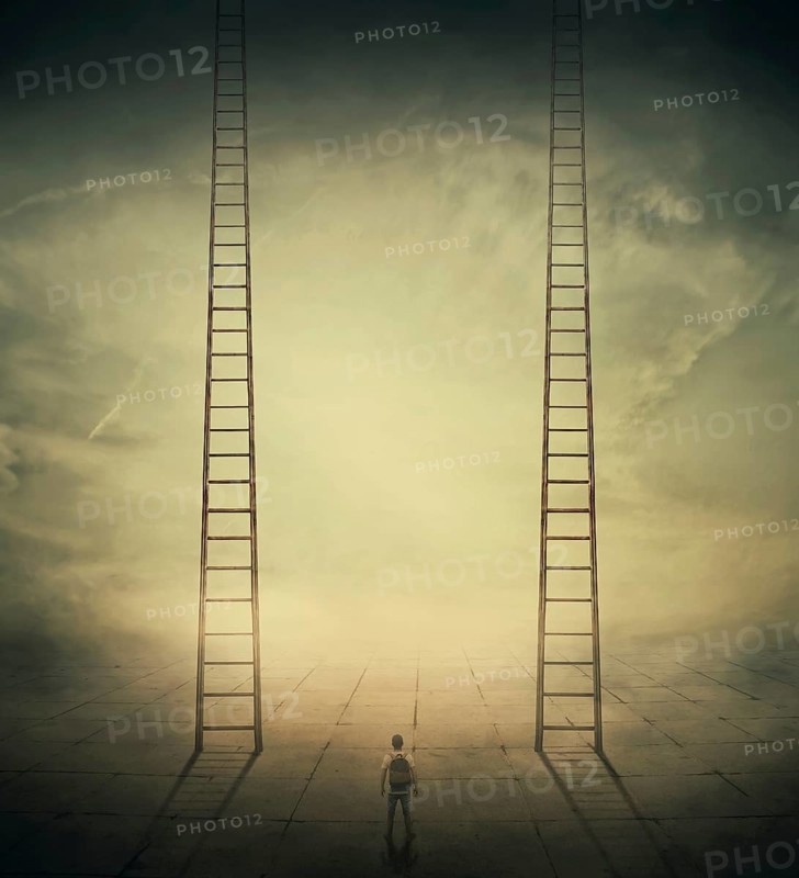Surrealistic concept as a man standing in a foggy street looking at two stairways