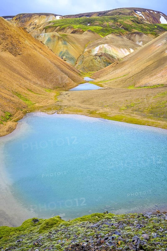 Turquoise lake at the foot of Brennisteinsalda