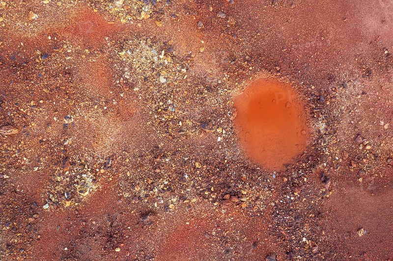 Little pool and extremely mineral-rich ground in the area of the Rio Tinto mines