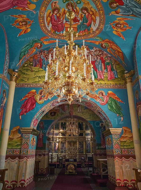 Beautiful painted walls and ceiling inside the Capriana Monastery