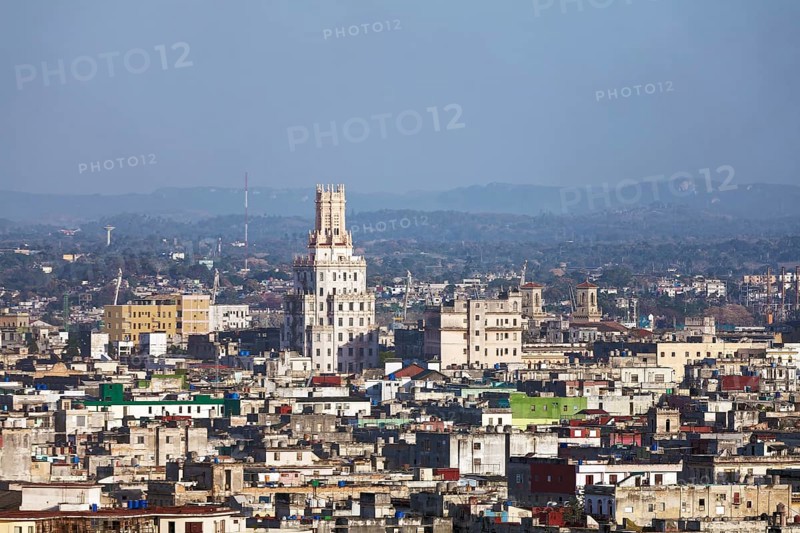 View over sea of houses with tower of the Cuban telephone company