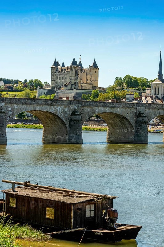 The Cessart bridge and Chateau de Saumur on river Loire