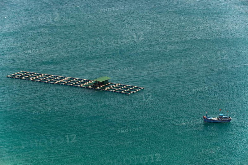 Fishing boat with fish traps in the China Sea