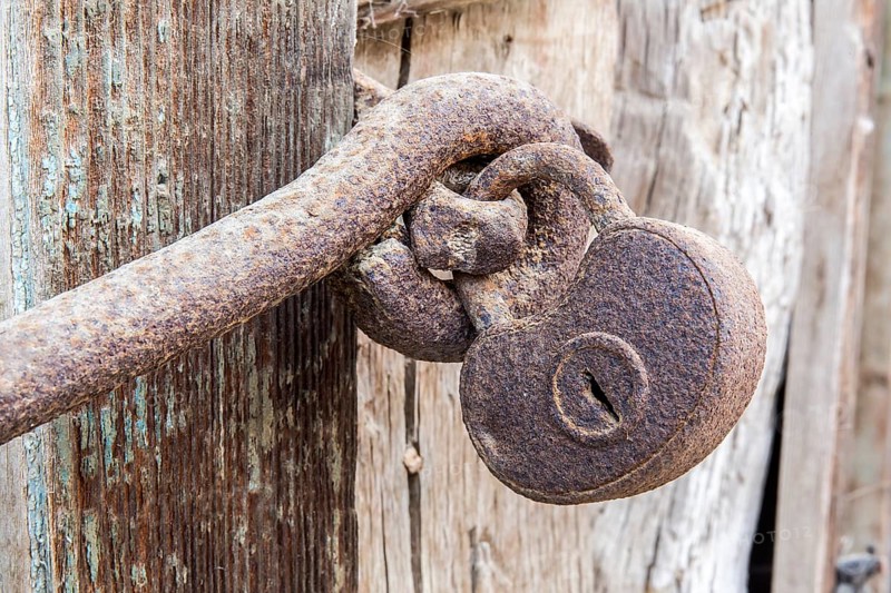 Macro view of a very old rusty padlock