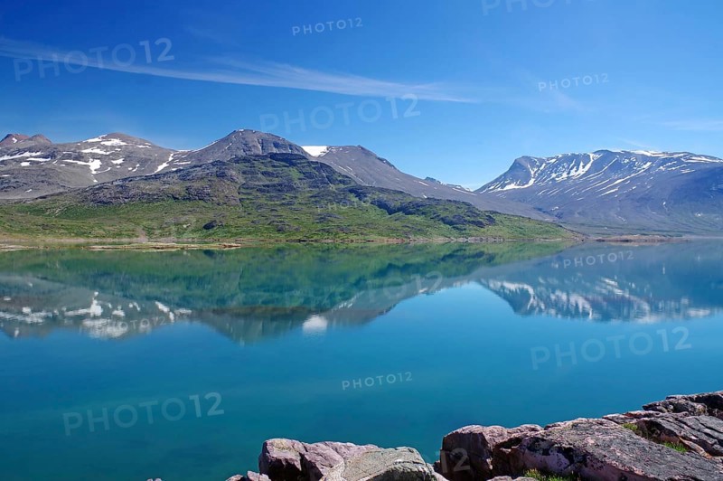 Mountains reflected in the fjord