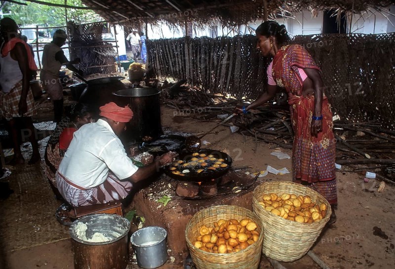 Preparing a sweet appam for Nattukottai Chettiar Nagarathar wedding feast in Chettinad
