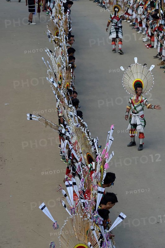 Naga tribesmen participating in the stone-pulling ceremony during the Kisima Nagaland Hornbill Festival