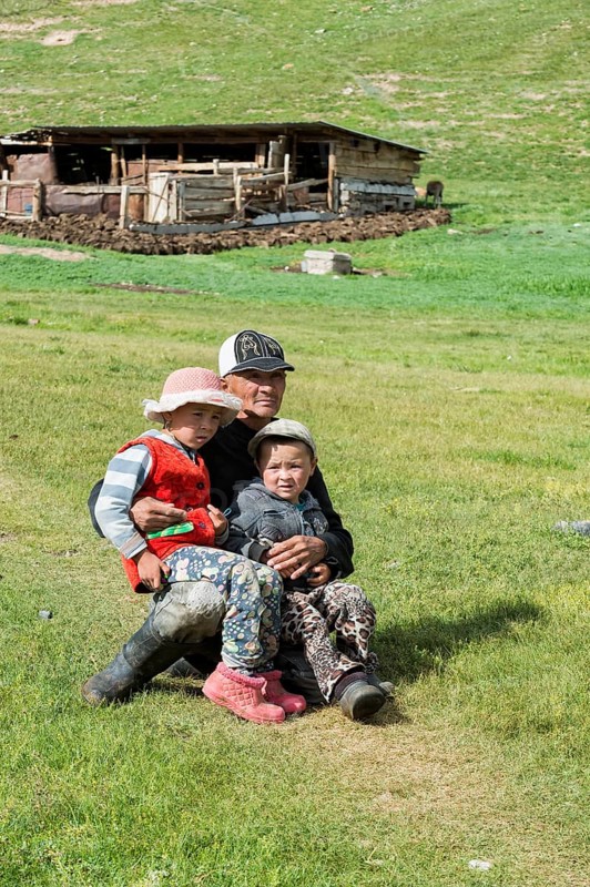 Kyrgyz man with his two children
