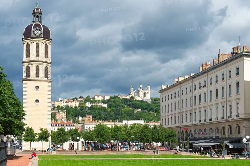 Bell tower of the former Hopital de la Charite and the Basilica Notre-Dame de Fourviere on the top of the hill