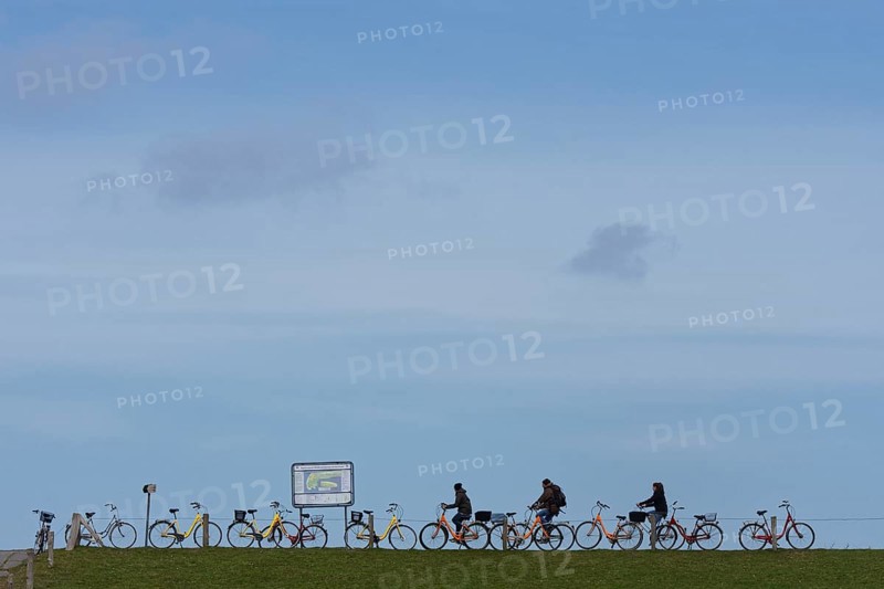 Parked bicycles and cyclists
