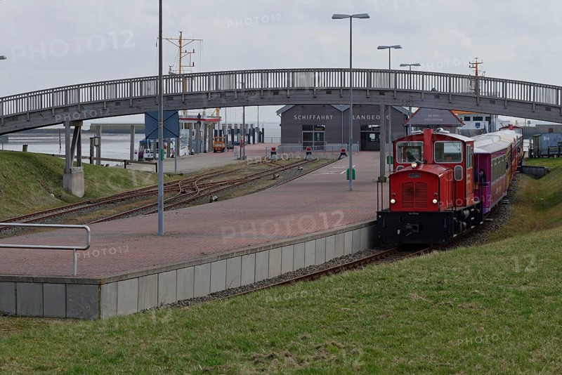 Island train leaves station at harbour