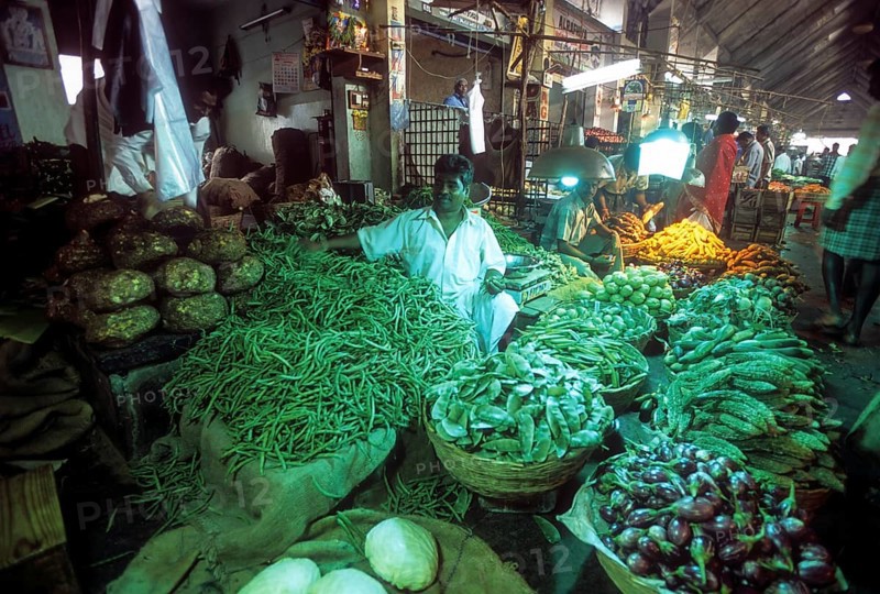 Vegetables under green light Koyambedu whole sale vegetable and fruit market is one of Asia's largest perishable goods market complex located in Chennai Madras