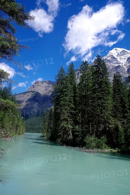 Glacial river with high mountains in the background