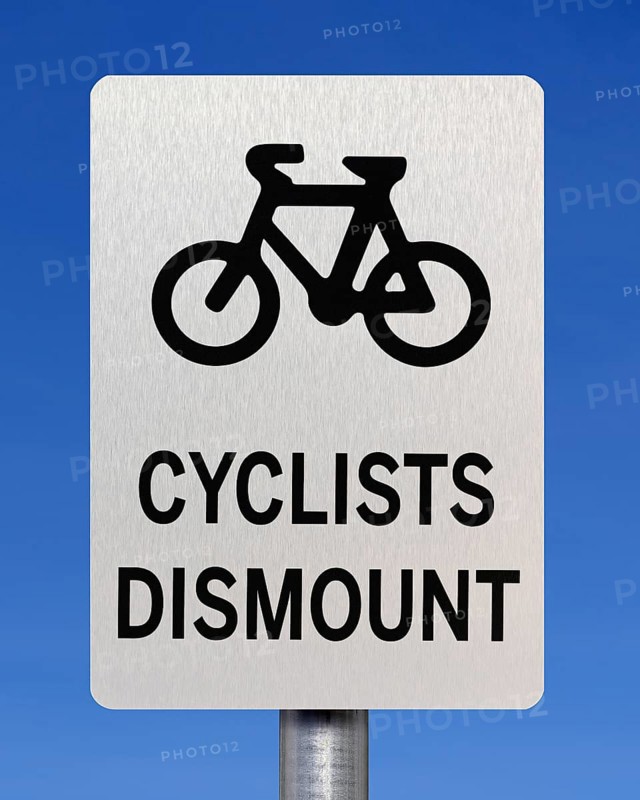 Cyclists dismount sign