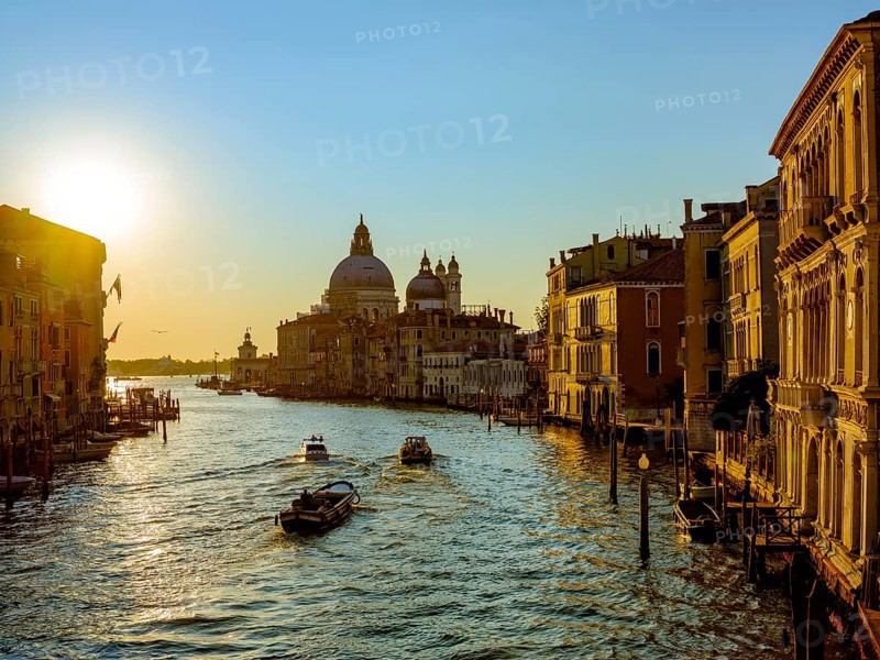 Boats in the Grand Canal at sunrise