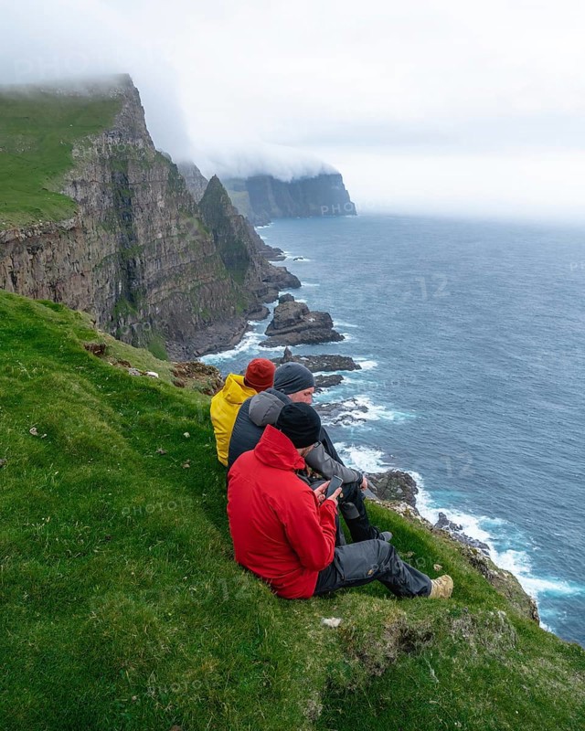 3 Walkers sitting overlooking Beinisforo Cliffs