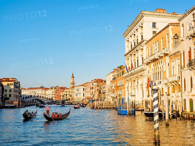 Gondolas next to historic house facades in the Grand Canal