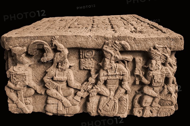 Yax Pasaj is presented with insignia of power by the founder of the dynasty Yax-Kuk-Mo'