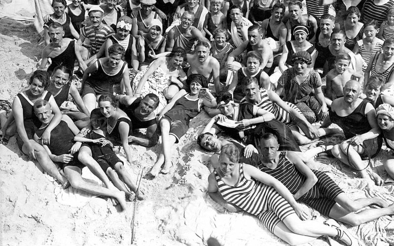 Group with bathers on the beach