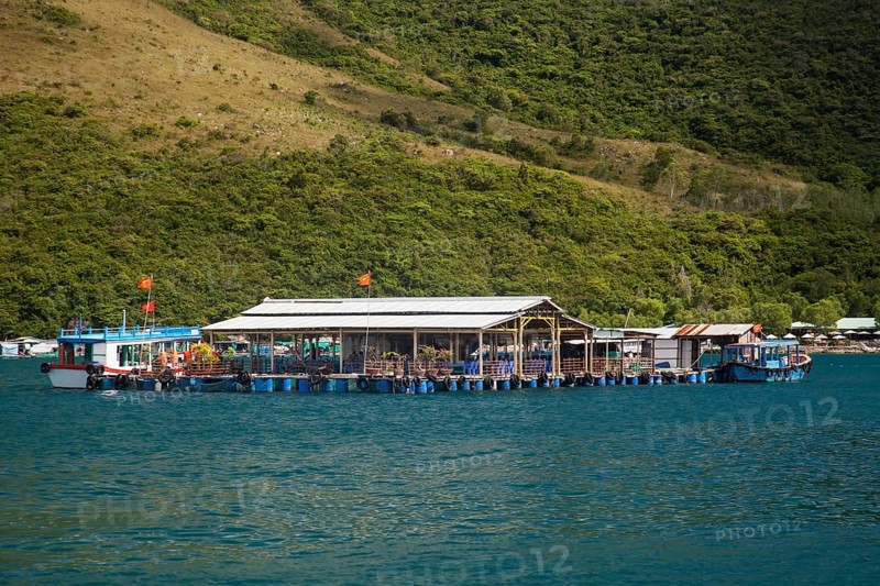 Floating houses in front of Ho Ca Tri Nguyen Island