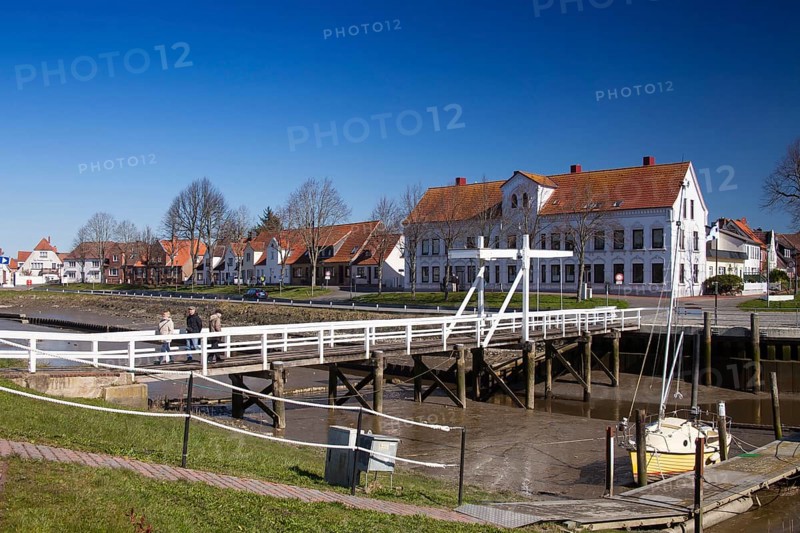 The old historic white bridge over the Toenning peat harbour