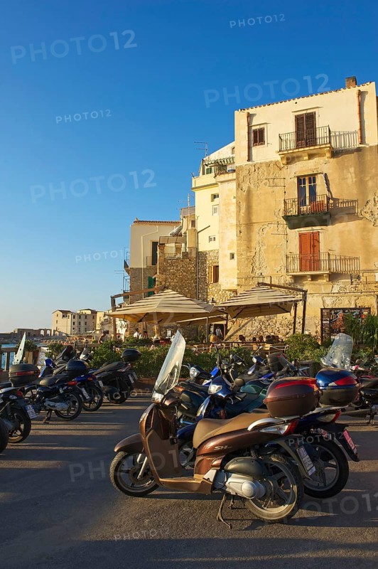 Vespas on the outskirts of the old town of Cefalu
