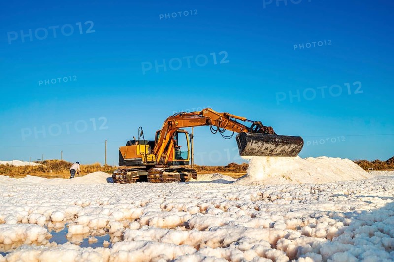 Excavator harvesting sea salt