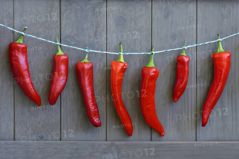 Red peppers hung to dry on string