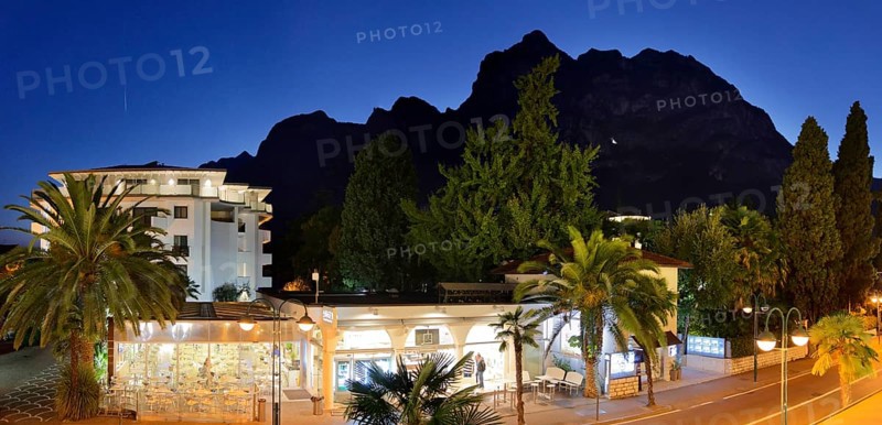 Viale Rovereto and Cina mountain range at sunset
