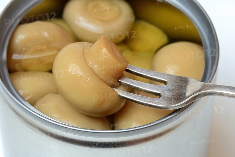 Canned pickled common mushrooms
